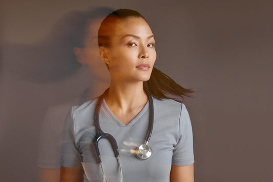 Blurry-image-of-woman-wearing-gray-jaanuu-scrubs-scaled.jpg