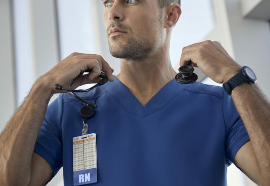 Male-nurse-wearing-blue-scrub-and-stethoscope-scaled.jpg