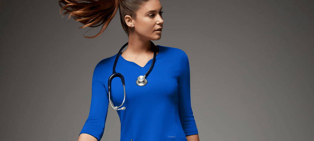 Nurse-wearing-bright-blue-jaanuu-scrubs.png