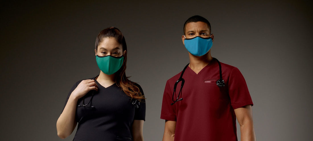 Woman-and-man-in-Jaanuu-scrubs-wearing-face-masks-scaled.jpg