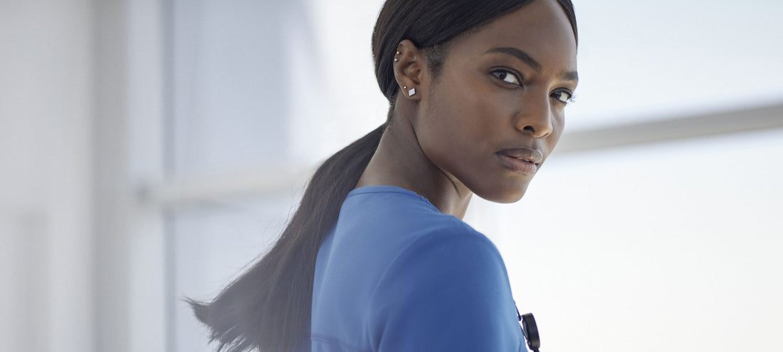 black-female-health-professional-wearing-blue-scrub-top-scaled.jpg