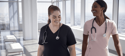 female-surgical-nurses-walking-and-smiling.png