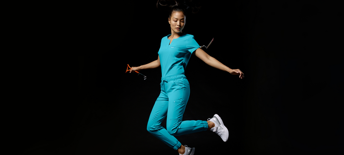 nurse-jumping-black-background-wearing-jaanuu-scrubs.png