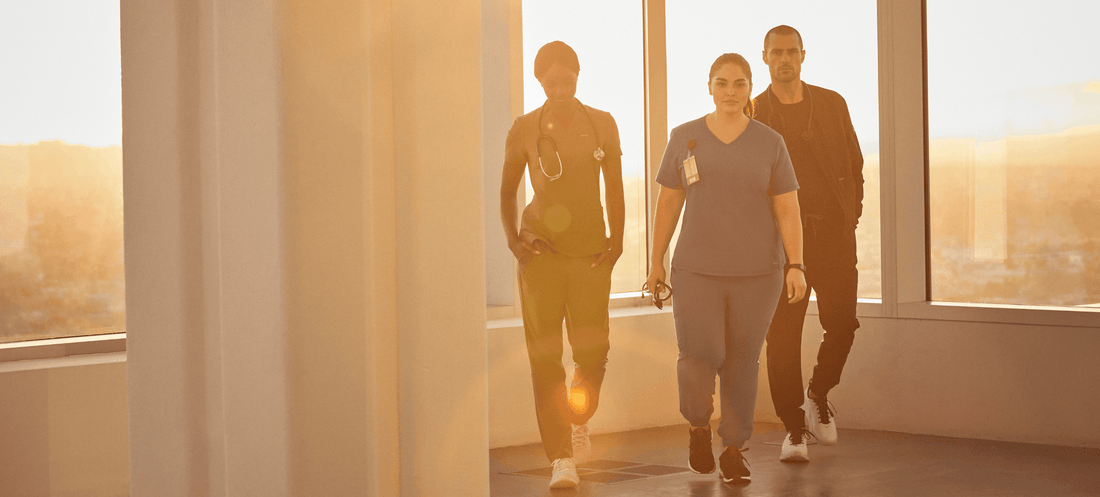 nurses-walking-in-scrubs-in-a-sunlit-room-1.png