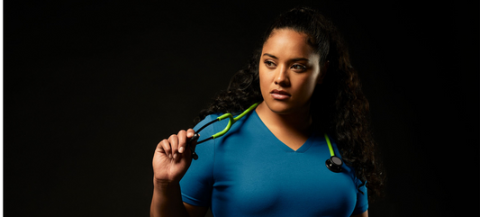 woman-with-scrubs-and-black-background.png