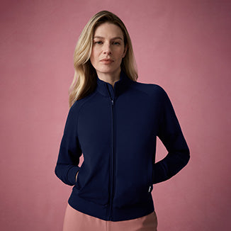 Woman wearing a midnight navy colored jacket.